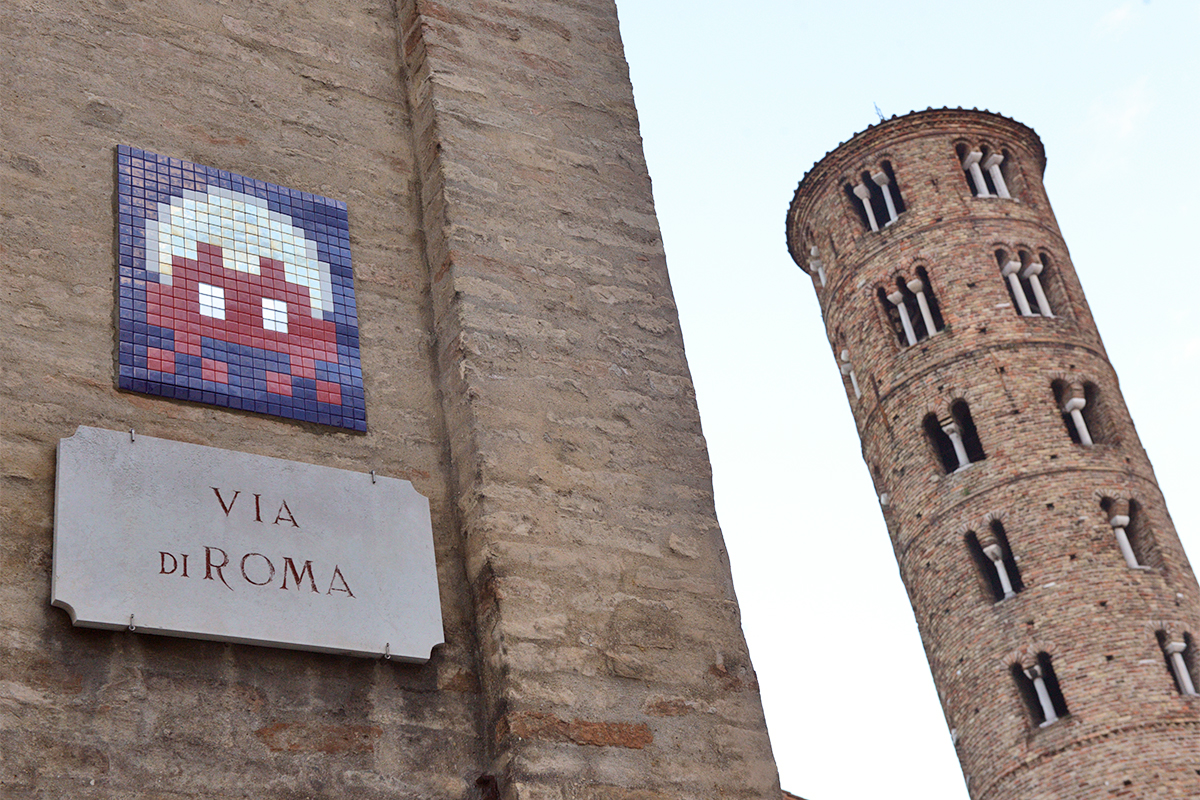 Facade of the Church of Santa Barbara (Ravenna) with work by Invader